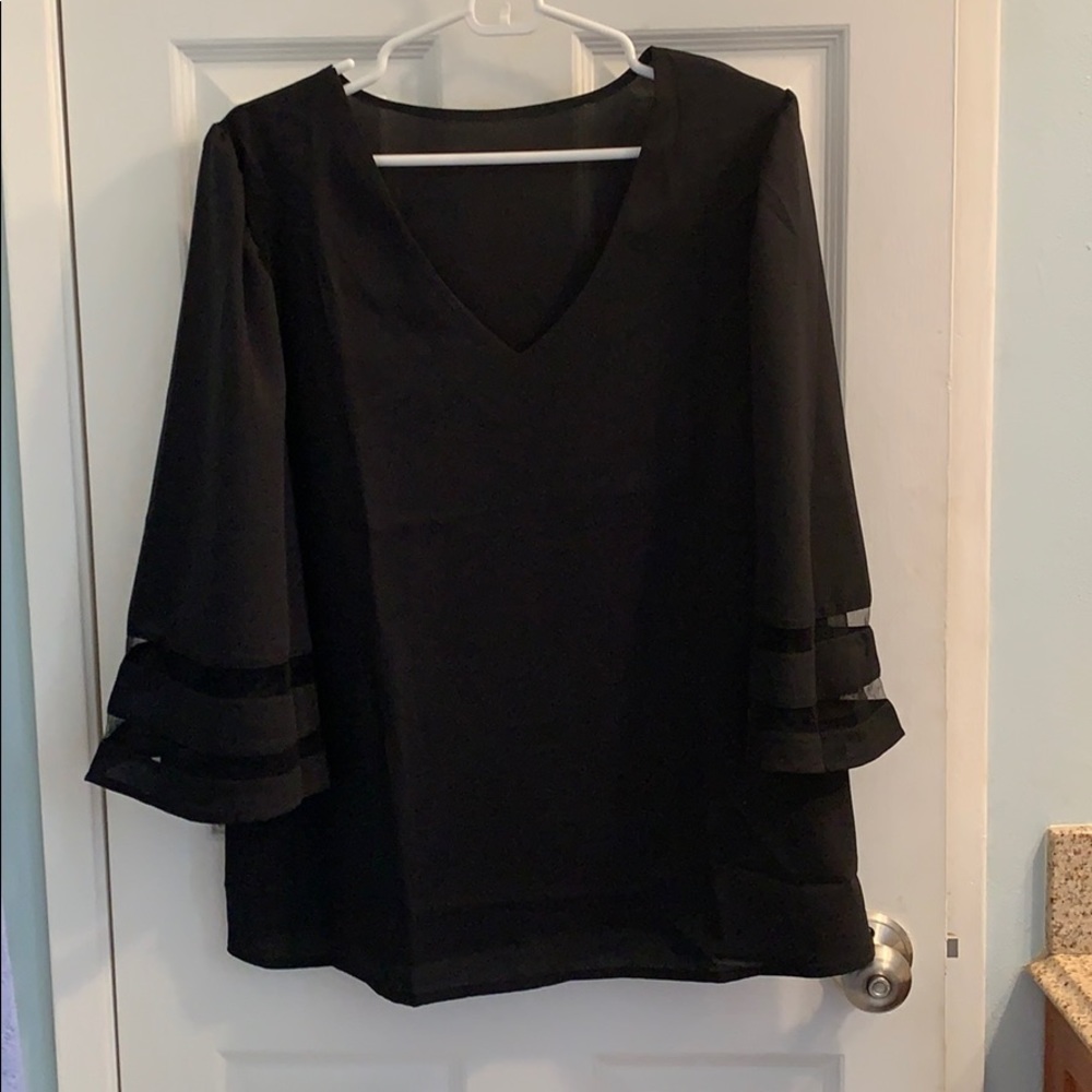 Black bell sleeved top